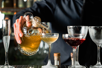bartender making cocktail in the bar
