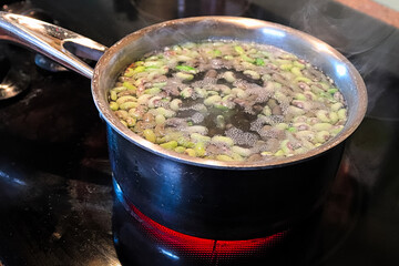 A pot of green beans being blanched in a pot of water