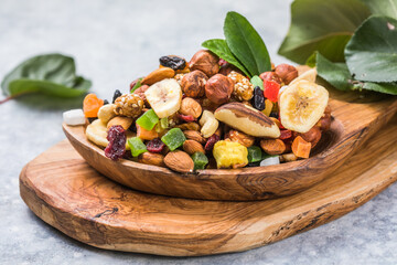 assorted dried fruits in wooden bowl. organic food background