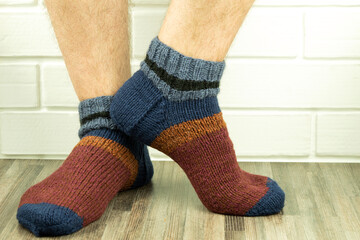 Handmade socks, warm and do-it-yourself knitted socks close-up