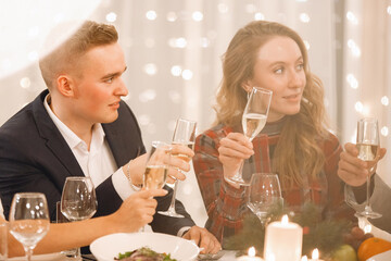 Young couple at the holiday table