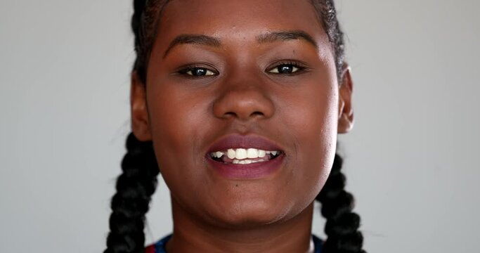 Black girl giving testimony to camera. African woman speaking in video conference, close-up face