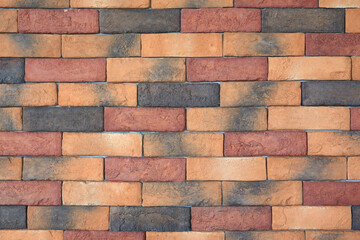 Multicolor new stone brick wall background.