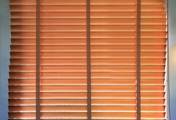 Sun shade blinds or curtain by the window.