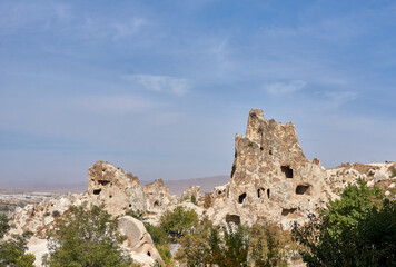 Fototapeta premium Ancient cave houses and rock formations near Goreme, Cappadocia, Turkey