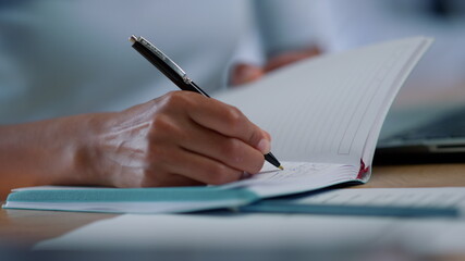 Businesswoman hands making notes in notebook. Business woman arms crossing text