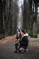Fototapeta premium a little boy tells what happened, and the father listens carefully to his son