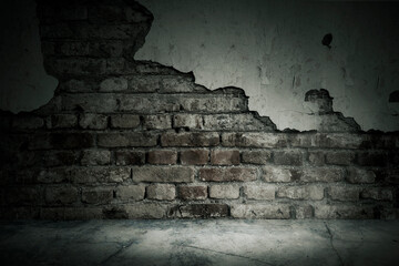 Damaged brick wall of an abandoned house