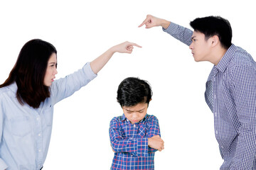 Parents arguing in front of their sad son on studio