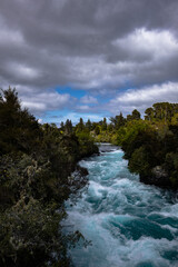 Fototapeta na wymiar New Zealand's Huka Falls on a cloudy day