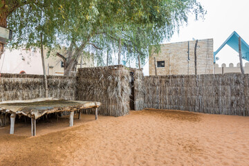 Fototapeta na wymiar Traditional ancient wood house in the Heritage folk village in Abu Dhabi, United Arab Emirates.