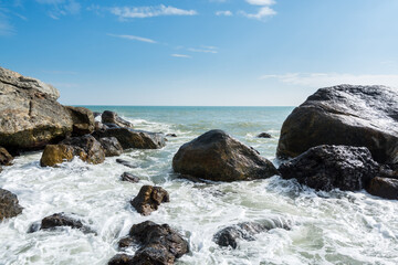 Seascape of waves splashing the stones in the rocky coastline of Yangxi, Yangjiang of China