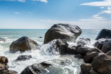 Seascape of waves splashing the stones in the rocky coastline of Yangxi, Yangjiang of China