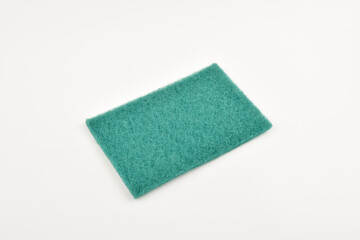 Green dishwasher scrubber on white background