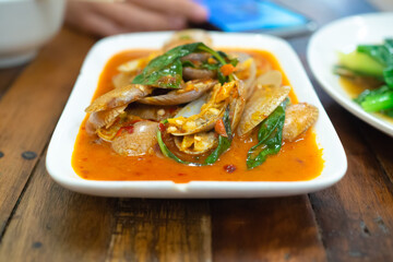stir fried spicy clams shell with basil leaves