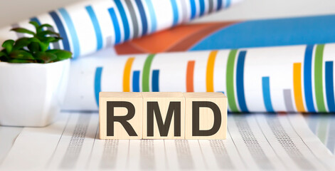 wooden block with words RMD required minimum distributions
