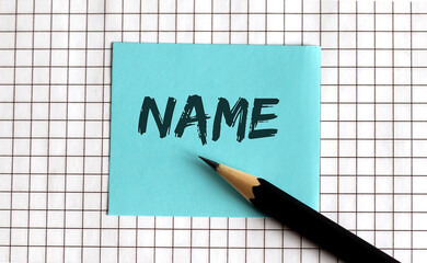 NAME , the phrase is written on colored stickers, on a notepad background. Business concept