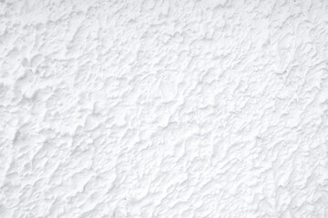 Rough surface white cement wall. White wall texture abstract background. Modern design of white background. Simple abstract wallpaper. White texture. Concrete surface. Exterior concrete building wall.