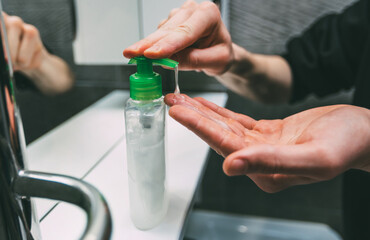 close up. young man washes his hands.