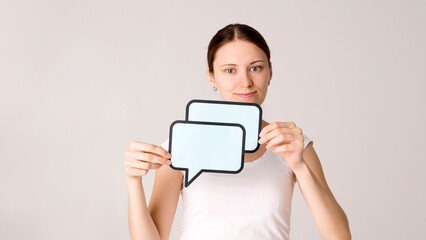 woman holding blank speech bubble