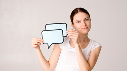 woman holding blank speech bubble