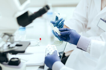 close up. doctors and pharmacist discussing a new drug .