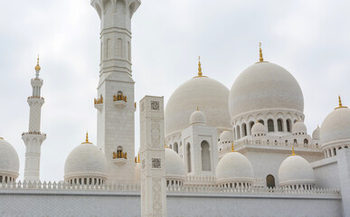 Domes of White Grand Mosque built with white marble stone, also called Sheikh Zayed Grand Mosque,...