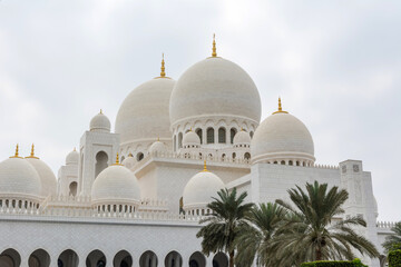 Domes of White Grand Mosque built with white marble stone, also called Sheikh Zayed Grand Mosque, inspired by Persian, Mughal and Moorish mosque architecture
