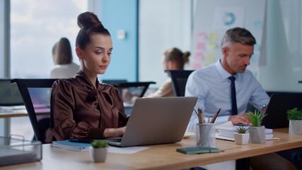 Obraz premium Pensive businesswoman using laptop.Female professional drinking coffee in office