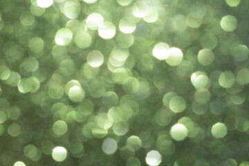 blurred festive emerald green glitter bokeh background