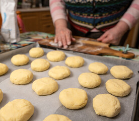 Woman preparing homemade pies at home