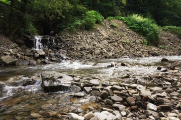 Summer in the Gorce, wet rocks in a fast mountain river © Piotr