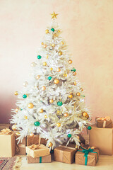 White Christmas tree and Christmas gifts in craft paper