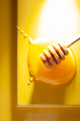 honey dripping from a dipper