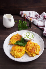 Fried cakes of grated potatoes on the plate with sauce. Traditional pancakes boxty raggmunk.