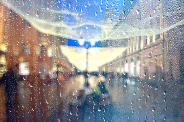 abstract autumn rain background in the night city, drops falling october night