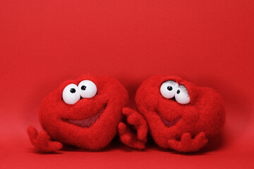 Two toy red cartoon hearts