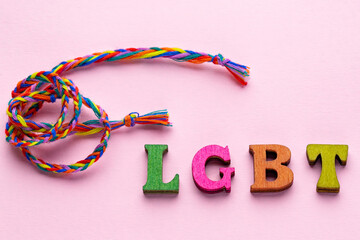 LGBT colorful lettering on pink background. LGBTQ rights concept