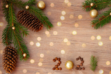 Christmas branches, pine cones, golden balls and a gift box. Christmas decor