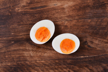 Boiled chicken eggs on wooden background