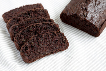 Homemade Chocolate Zucchini Bread on cloth, side view.