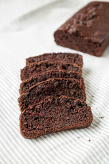 Homemade Chocolate Zucchini Bread on cloth, side view.