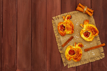 Homemade apple dessert, portioned puffs with fragrant cinnamon sticks