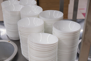 Close up shot of white bowls stacks at canteen