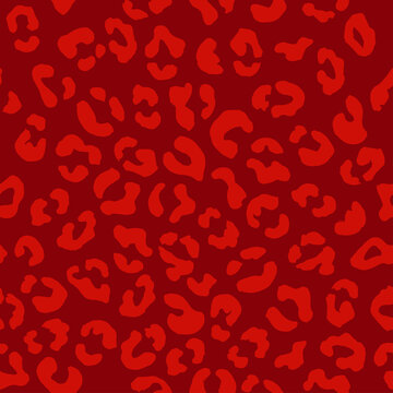 Leopard seamless pattern. Vector animal print. Light red spots on a pbright red background. Jaguar, leopard, cheetah, panther fur. Leopard skin imitation can be painted on clothes, paper or fabric.