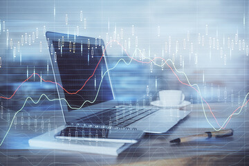 Financial market graph hologram and personal computer on background. Double exposure. Concept of forex.