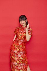 Asian woman wear Chinese dress with action