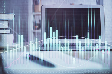 Forex market chart hologram and personal computer background. Double exposure. Concept of investment.