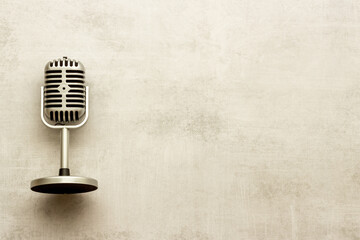 Fototapeta premium Retro style microphone. Aydio recording background. Top view