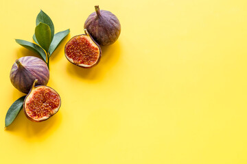 Fresh figs with green leaf. Mediterranean fruit background